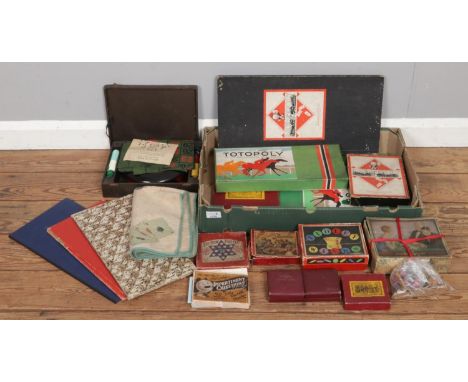 A large box of vintage games, including Totopoly, Monopoly, Tiddlywinks, Roulette Wheel includes balls and assorted puzzles e