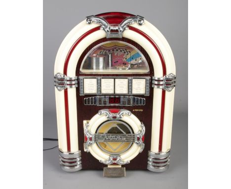 A Steepletone CD player formed as a novelty jukebox.