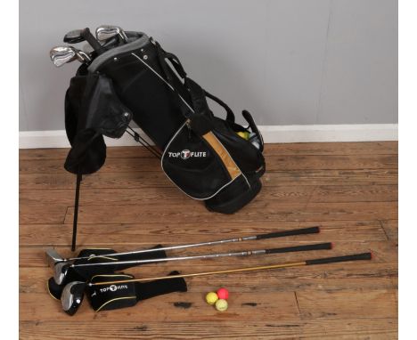 A collection of Top Flite Executor golf clubs in corresponding storage bag with headcovers along with a collection of mixed g
