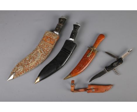 A Decora Soligen hunting knife with three other decorative Kukri style knives. CANNOT POST