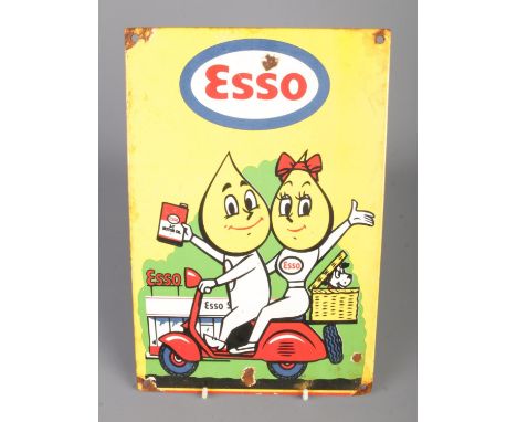 An Esso Motor Oil enamel sign featuring Mr. and Mrs. Drip riding a scooter. Approx. dimensions 20cm x 30cm.