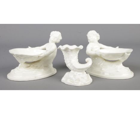 A pair of Royal Worcester salts, modelled as a merboy and mermaid along with a Royal Worcester Cornucopia vase. Models 349 an