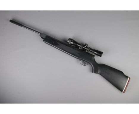 A Hatsan Edgar Brothers MOD 60S .22cal break barrel air rifle. With Quattro trigger and fitted with Nikko Stirling Mountmaste