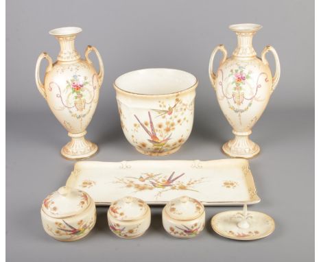 A small collection of Crown Ducal ceramics including dressing table set and vases. One vase damaged to rim and repaired to ha