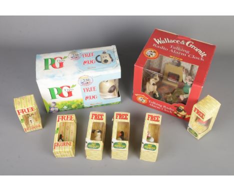 A box of Wallace &amp; Gromit collectables to include boxed Wesco talking radio alarm clock, Typhoo figures and PG tips mug.