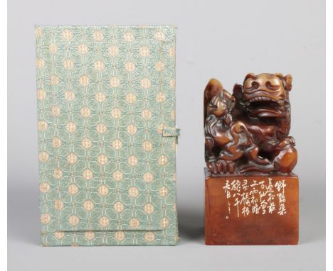 A Chinese carved soapstone chop wax seal stamp surmounted with Foo dog with pup in original presentation box. Height: 15cm Wi
