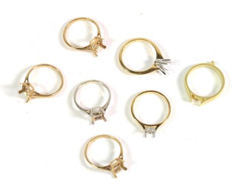 Three 18 carat gold vacant ring mounts, finger sizes N1/2, N1/2 and O; and four 9 carat gold vacant ring mounts, all finger s