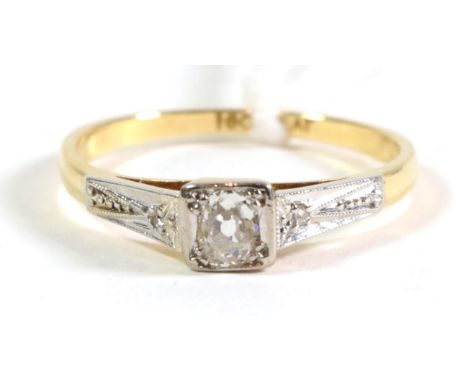 A diamond solitaire ring, with diamond set shoulders, total estimated diamond weight 0.30 carat approximately, finger size Q.