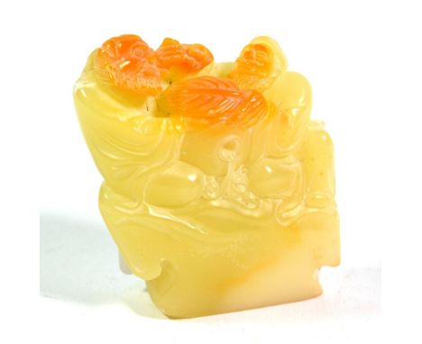 A Chinese carved jade group of two bearded men sitting beside a vase, 7cm high