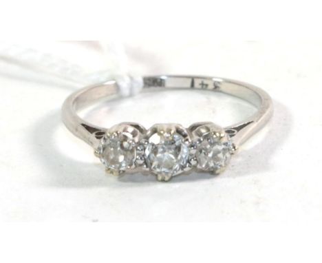 A three stone diamond ring, stamped 'PLAT', total estimated diamond weight 0.50 carat approximately,  finger size M1/2.  Gros