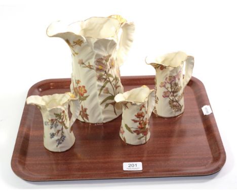 Four Royal Worcester blush ivory and floral decorated leaf moulded jugs, tallest 23cm (a.f.)