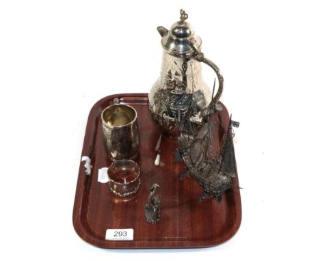 A white metal filigree model of a triple masted ship bearing the Maltese flag; a silver christening mug; silver bookmark; sil