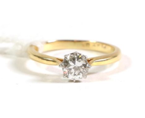 An old cut solitaire diamond ring, in claw setting, to tapered shoulders, estimated diamond weight carat approximately 0.65 c