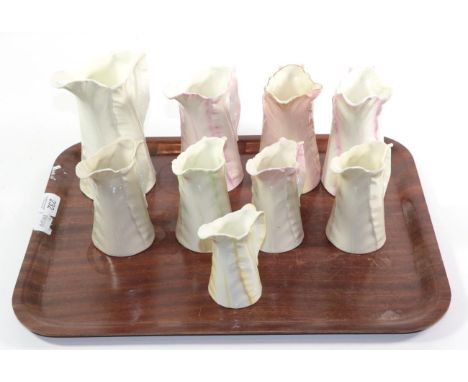 Nine Royal Worcester leaf moulded jugs, tallest 18cm