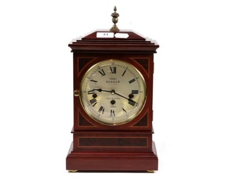 A modern chiming mantel clock retailed by Sewills, Liverpool