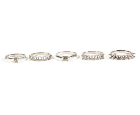 Five platinum vacant ring mounts, finger sizes L, M, N1/2, O1/2 and P (5).  Gross weight - 25.03 grams