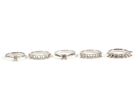 Five platinum vacant ring mounts, finger sizes L, M, N1/2, O1/2 and P (5).  Gross weight - 25.03 grams