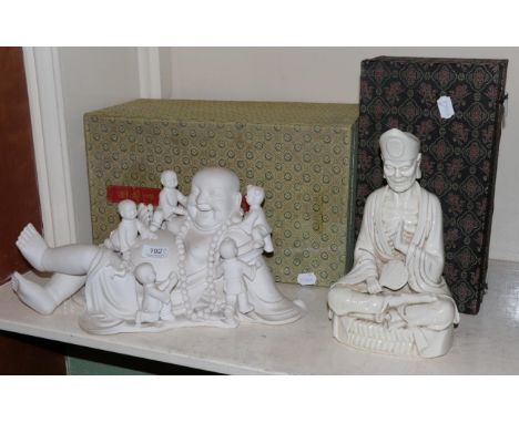 A modern Chinese plaster group of Buddha and playing children; together with a Blanc de Chine figure of a seated Louhan of si