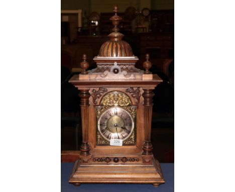 A German walnut striking mantel clock