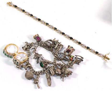 Two silver charm bracelets hung with various charms including an elephant, a dog, binoculars etc, length 19cm and 18cm; two d