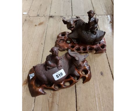 A pair of vintage Chinese carved wood water buffaloes (a/f) - sold with associated pierced stands