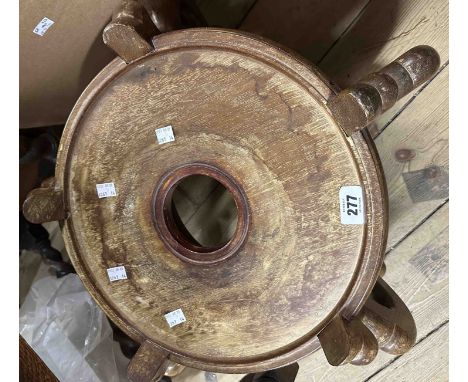 A 35cm (aperture) diameter Chinese hardwood ornate vase stand with five scroll supports and pierced centre