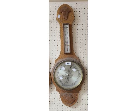 An early 20th Century oak framed banjo barometer/thermometer with silvered dial and aneroid works - dial glass a/f
