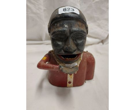 A vintage painted cast iron 'Jolly' style money box Notice from the the-saleroom.com: These items are listed on the basis the