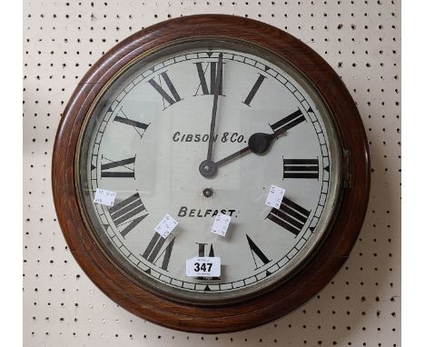 An old stained beech framed dial wall timepiece with dial marked for by Gibson &amp; Co., Belfast and eight day spring driven
