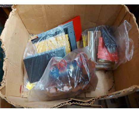 A box containing a quantity of vintage plastic building construction sets and a bag containing a similar later castle set - s