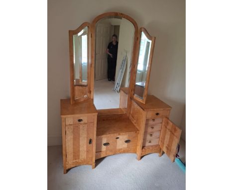 A 1.46m vintage burr maple and satin birch American dressing chest with triple mirror over a stepped base with central deep d