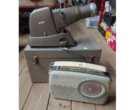 A vintage boxed Aldis projector - sold with a Bush radio