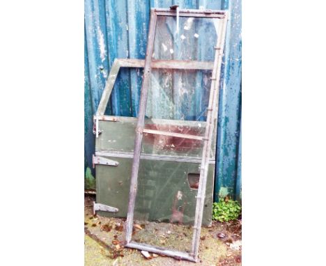 An old Land Rover windscreen - sold with a similar front door