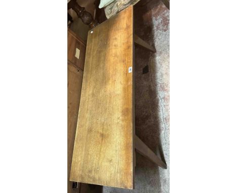 A 1.25m vintage mahogany coffee table, set on swept tapered legs