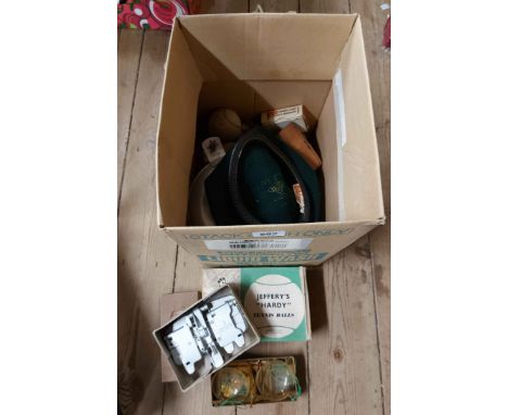 A box containing a quantity of mixed collectable items including a boxed set of apothecary scales, a Scout's felt cap, vintag