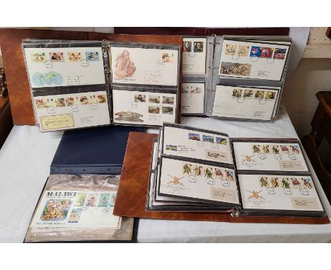 Two brown Royal Mail First Day Covers albums containing 1980's GB examples - sold with another containing 1990's GB FDCs and 