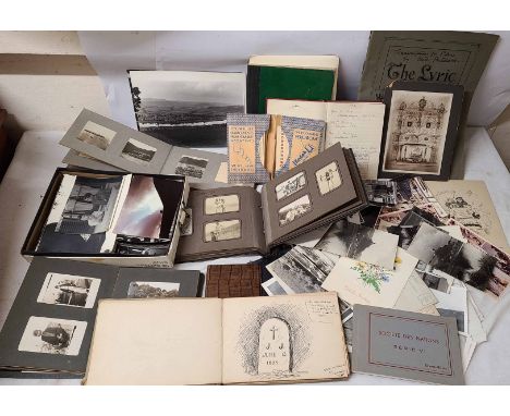 A box containing a quantity of assorted 20th Century family and other photographs, other paper ephemera, a sketch book contai