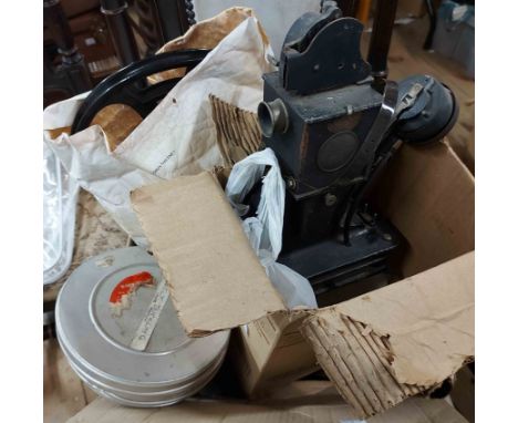 A quantity of film reels including a vintage Donald Duck cartoon, an Ugly Duckling cartoon, etc. - sold with an antique 'Baby