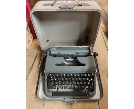 A cased 1960's Olympia typewriter