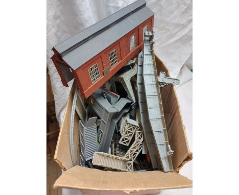 A box containing a quantity of model railway items including bridges, crane, engine house, track, etc.