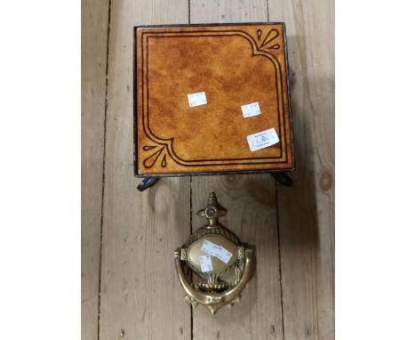 A brass door knocker of classical urn form - sold with a tile topped plant stand with wrought iron base