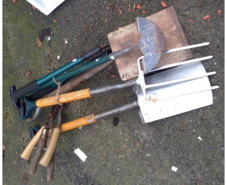 A quantity of garden tools including spades, fork, shears, etc.