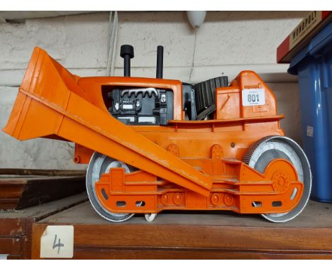 A vintage Louis Marx battery powered giant bulldozer toy