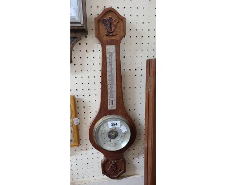 A small 20th Century carved oak framed Comitti banjo barometer/thermometer with aneroid works
