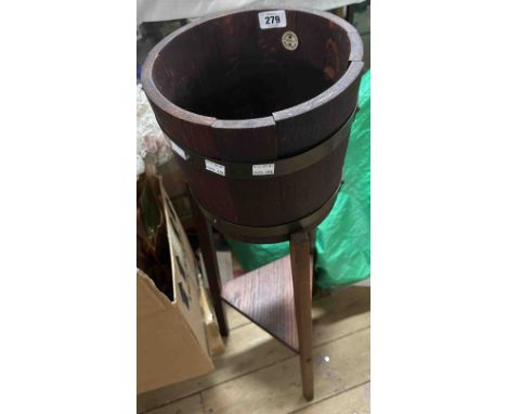 A vintage R.A. Lister coopered barrel jardinière stand with brass binding, set on triple slender supports with undertier