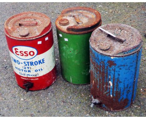 Three vintage oil drum cans including Esso Two Stroke, etc.