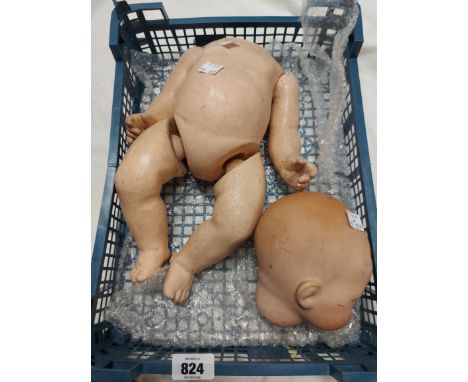 An early 20th Century Armand Marseille porcelain headed baby doll with composition body - head detached