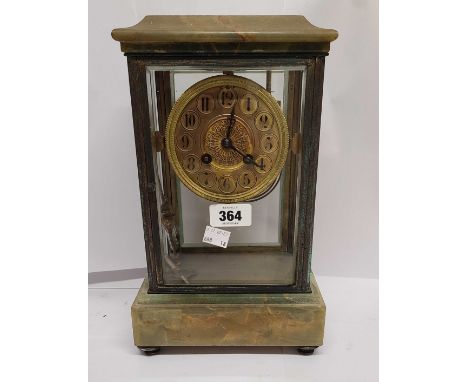 A late Victorian brass and onyx four glass table clock with decorative gilt dial, visible mercury pendulum and S. Marti 'Gold