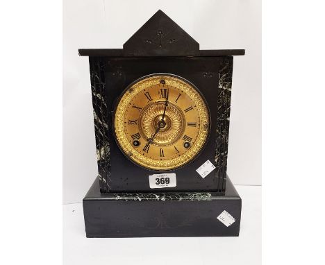 A late Victorian black slate and green marble cased mantel clock with decorative gilt dial and eight day gong striking moveme