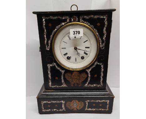 A late 19th Century simulated black slate cased mantel clock with decorative mother-of-peal and other inlaid decoration, whit